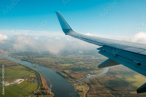 aiplane wing, landscape aerial and blue sky