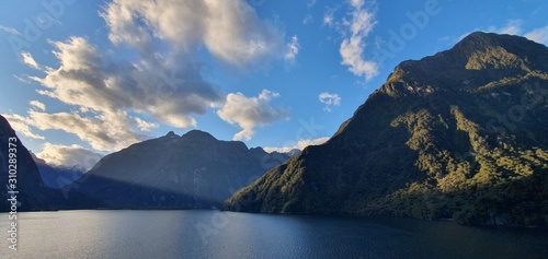 Milford Sound Fjord, Milford Sound / New Zealand - December 18, 2019: The Dramatic Mountains and Waterfalls of the Milford Sound Fjord, New Zealand photo