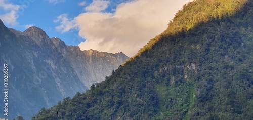 Milford Sound Fjord, Milford Sound / New Zealand - December 18, 2019: The Dramatic Mountains and Waterfalls of the Milford Sound Fjord, New Zealand photo