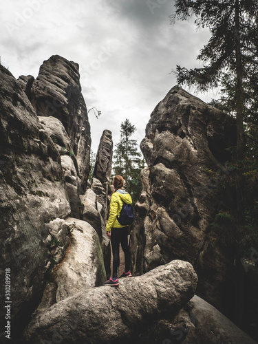 woman standing on rock 
