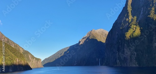 Milford Sound Fjord, Milford Sound / New Zealand - December 18, 2019: The Dramatic Mountains and Waterfalls of the Milford Sound Fjord, New Zealand photo