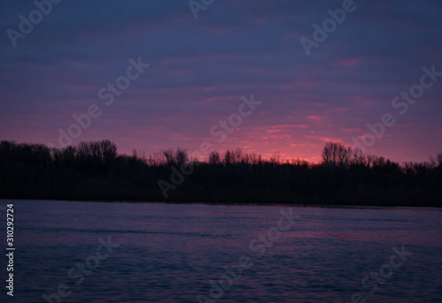 Color autumn sunset with a river 