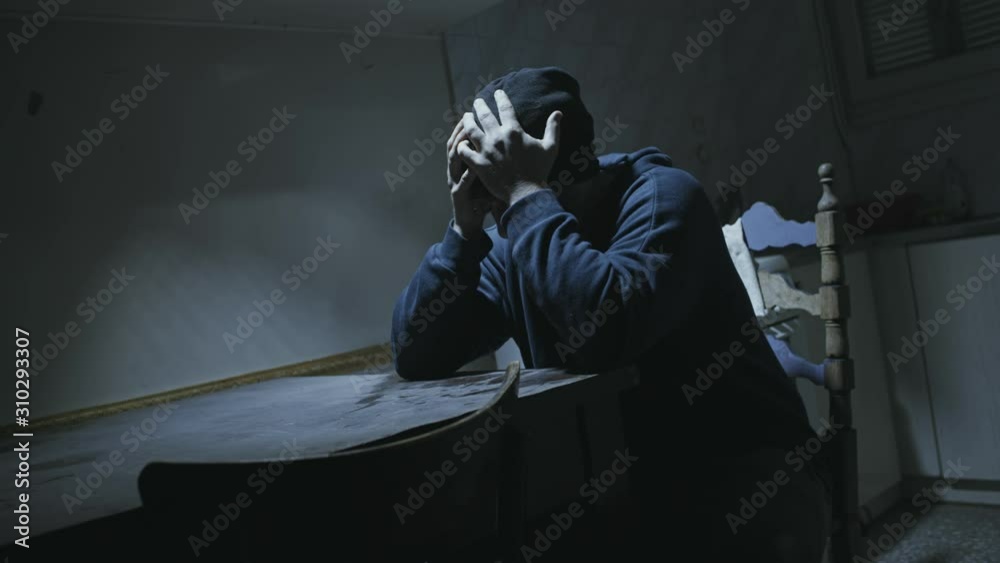 Depressed angry or paranoid man in despair alone at his old dirty house. Depressed angry or paranoid man in despair alone at his old dirty house.