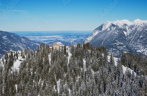 Das Kreuzeckhaus im Winter mit Blick ins bayerische Alpenvorland, Berghütte bei Garmisch-Partenkirchen photo