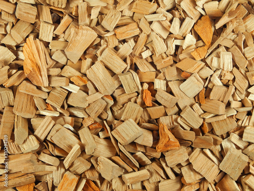Natural texture of wood chips for smoking or gardening. Lumber, sawdust background. © Yana Bo