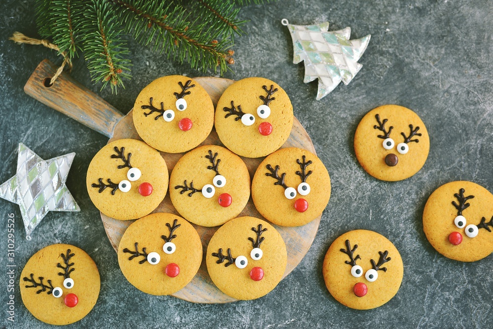 Cute New Year and Christmas gingerbreads Santa Deer. Homemade Christmas baking.