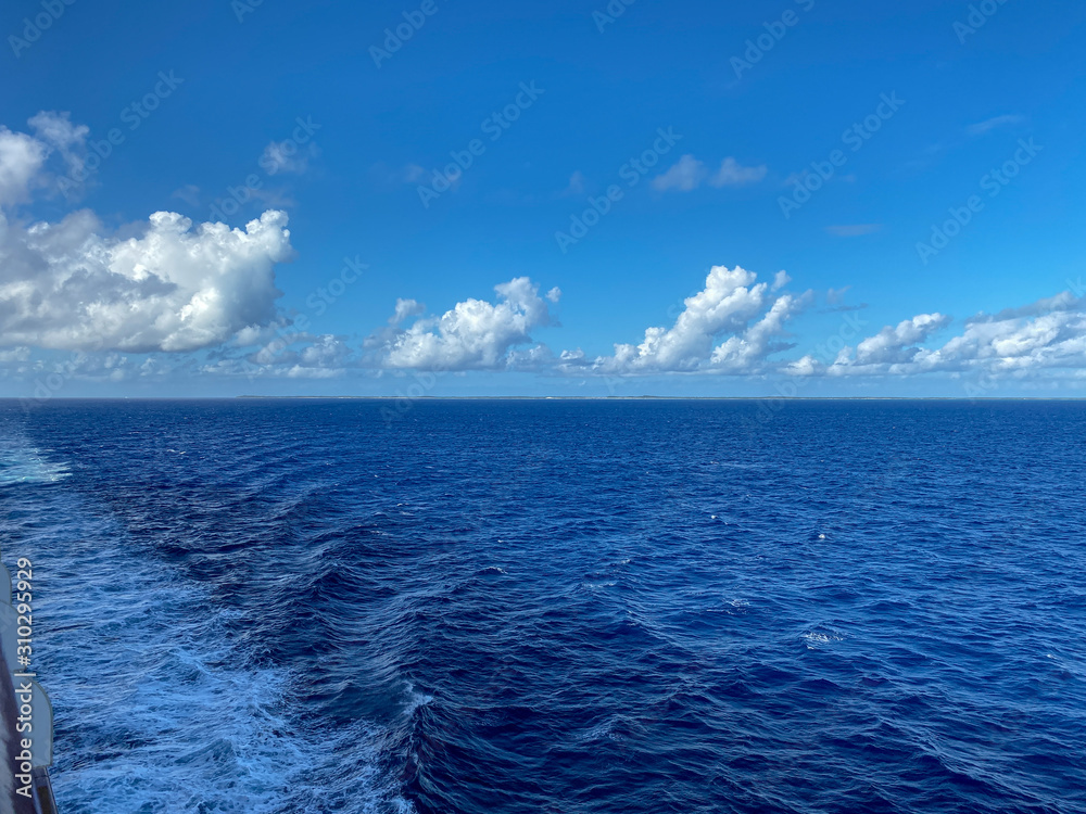 Obraz premium The Holland America Line Zuiderdam cruise ship sailing away from the private island of Half Moon Cay