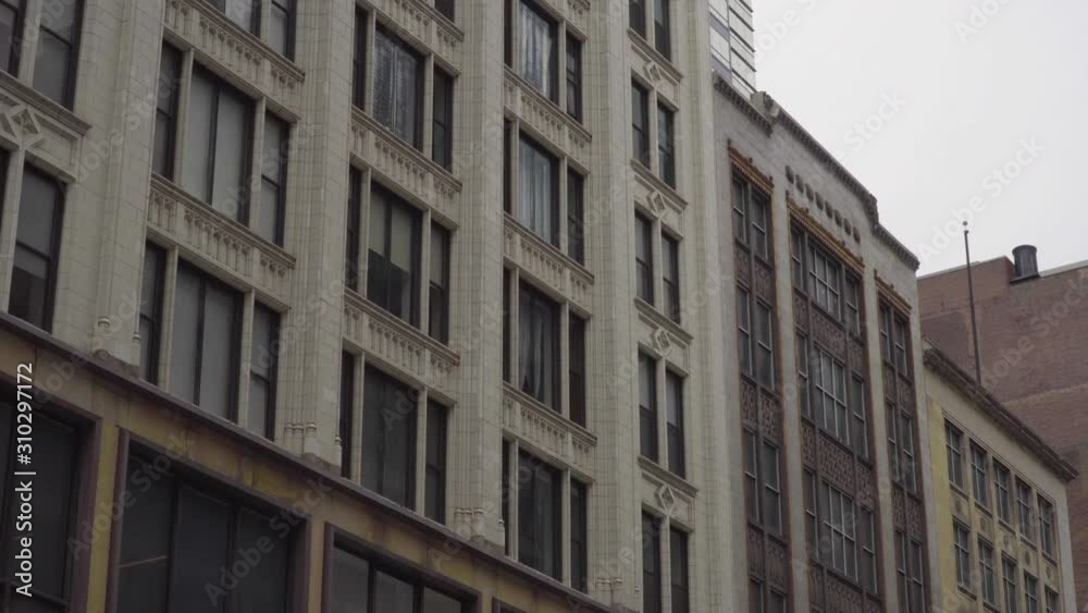Typical day time generic exterior establishing shot of an urban luxury apartment building in day time DX. Lock down scene setting Typical day time generic exterior establishing shot of an urban luxury apartment building in day time DX. Lock down scene setting