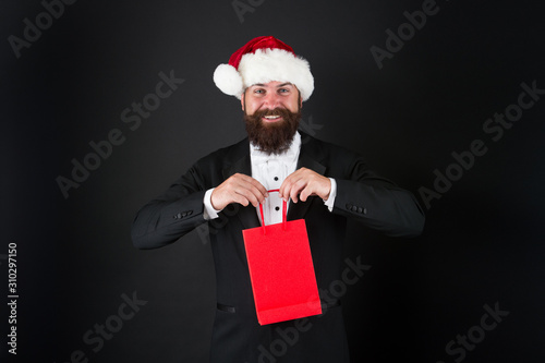 Very merry sale. Santa boss hold shopping bag. Happy businessman enjoy discount days. Happy holidays. Merry Christmas. Happy new year. Happy holiday season, copy space