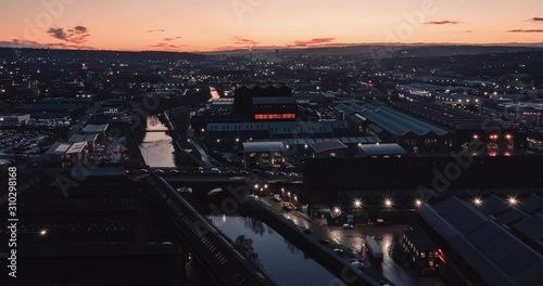 Aerial time lapse of the industrial city of Sheffield and the river don during a beautiful sunset in December 2019