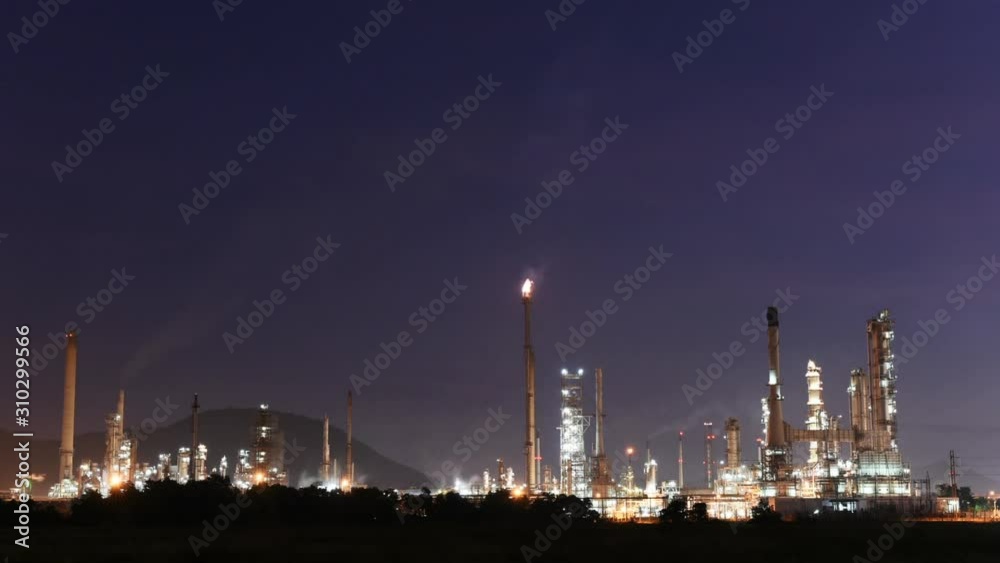 Oil and chemical factory refinery plant at night - Time lapse Oil and chemical factory refinery plant at night - Time lapse