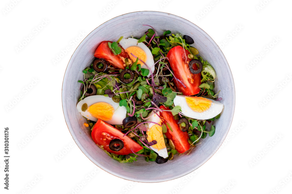 Healthy vegetable salad with mixed green leaves (arugula, mesclun, lettuce), eggs, black olives, tomato and bean sprouts. white background. Top view Healthy vegetable salad with mixed green leaves (arugula, mesclun, lettuce), eggs, black olives, tomato and bean sprouts. white background. Top view