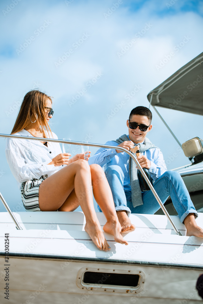 Two young tourists having fun on boat tour in the summertime Two young tourists having fun on boat tour in the summertime