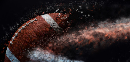 American football ball close up on black background.