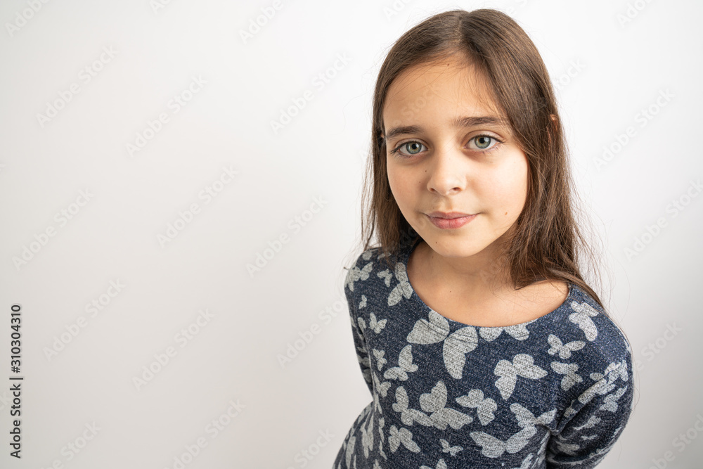 Close up portrait of the beautiful young brunette girl with green eyes looking at the camera isolated over white background Close up portrait of the beautiful young brunette girl with green eyes looking at the camera isolated over white background