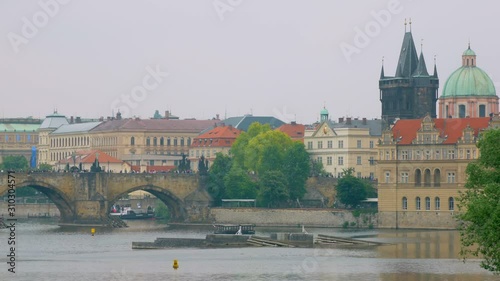 calm landscape in Prague city in spring cloudy day, Vltava river, Charles bridge photo