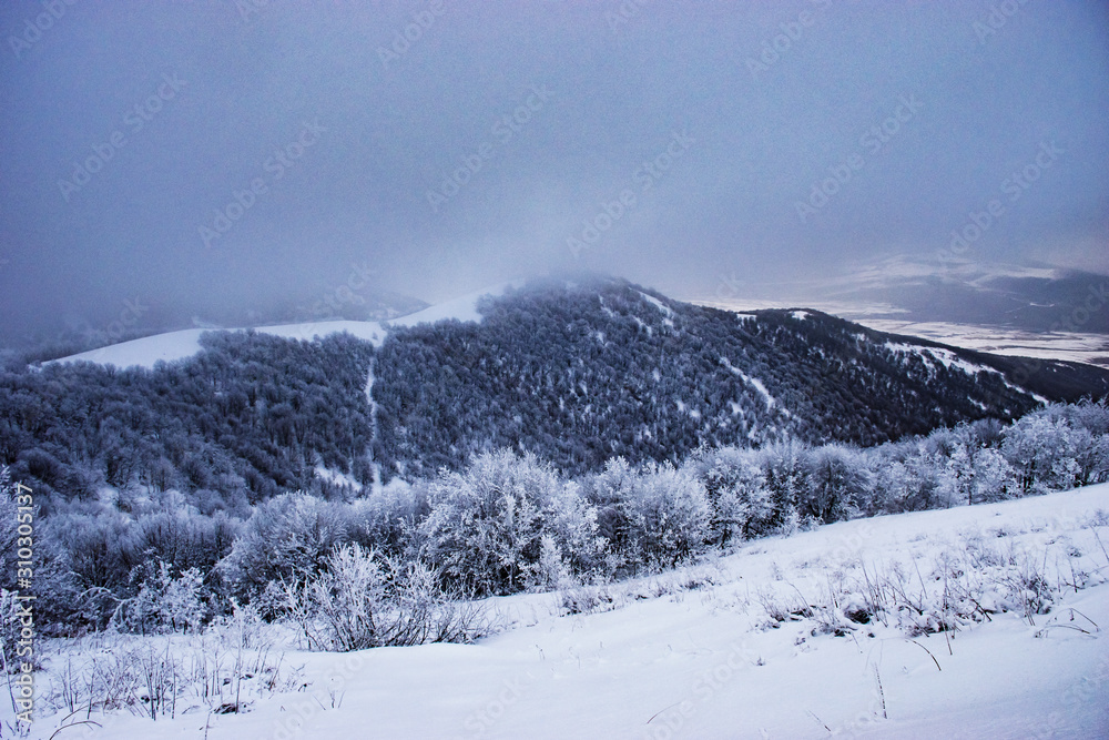 winter landscape with mountains and blue sky