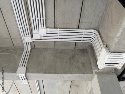 Installation of electrical wiring on the ceiling.Electrical cable system installation.