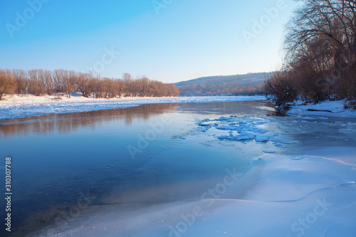 natural scenery with flowing ice on the river water  © russieseo