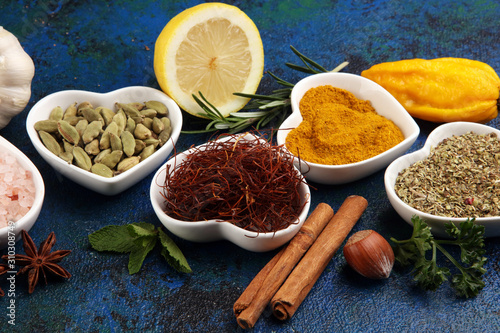 Spices and herbs on table. Food and cuisine ingredients with oil and vinegar