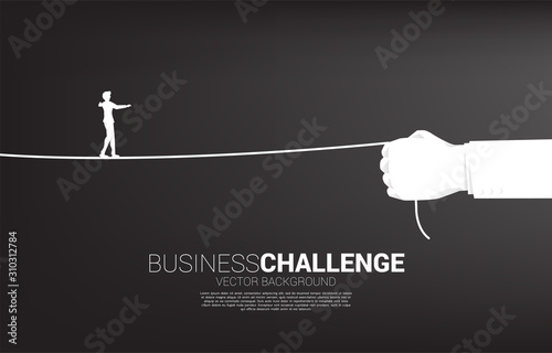 silhouette of businessman walk rope in businessman hand. Concept of Business challenge and career path.