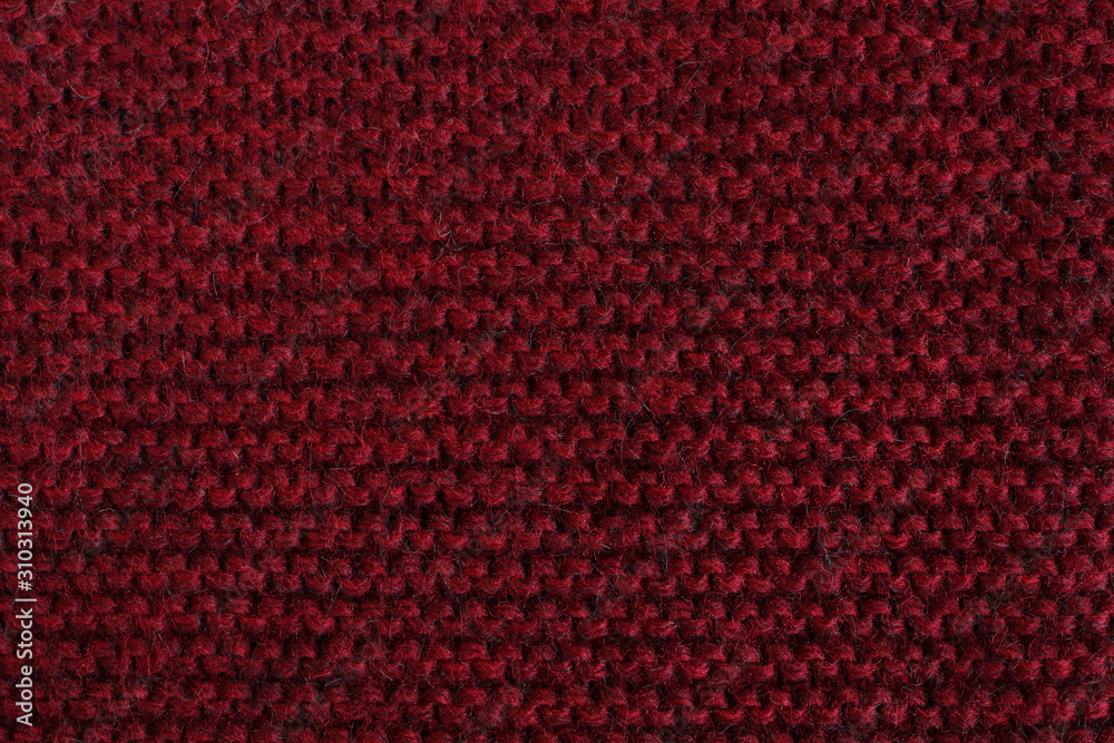 Marsala woolen knitted fabric texture. Macro. Marsala woolen knitted fabric texture. Macro.