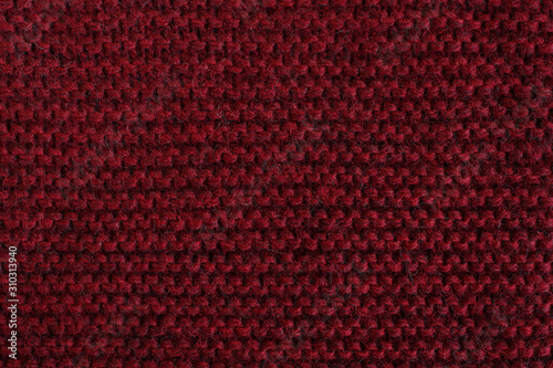 Marsala woolen knitted fabric texture. Macro.