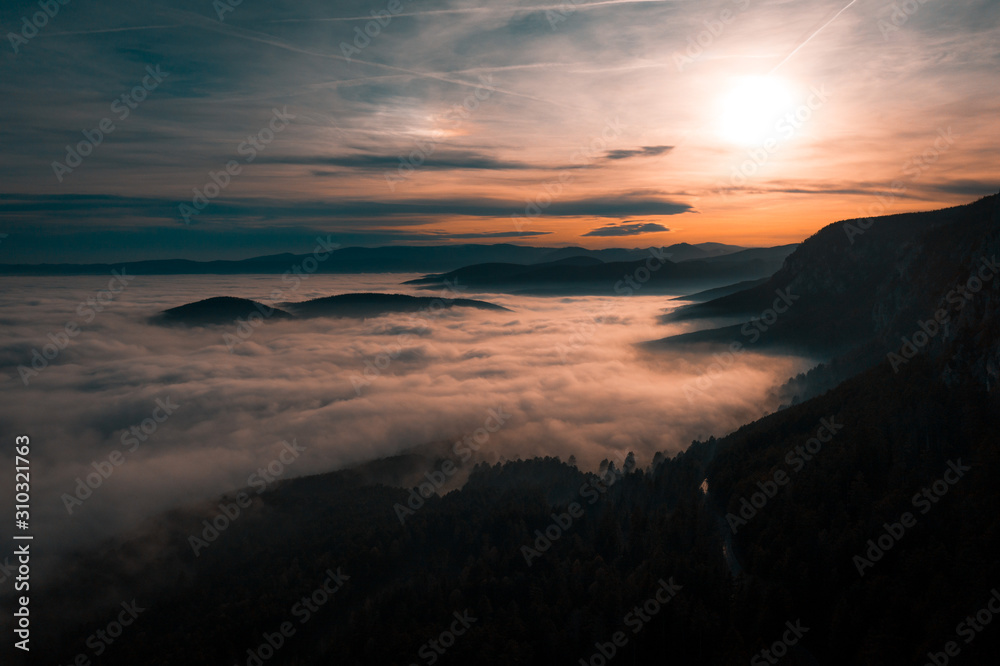 mountain landscape during sunset with a lot of fog mountain landscape during sunset with a lot of fog