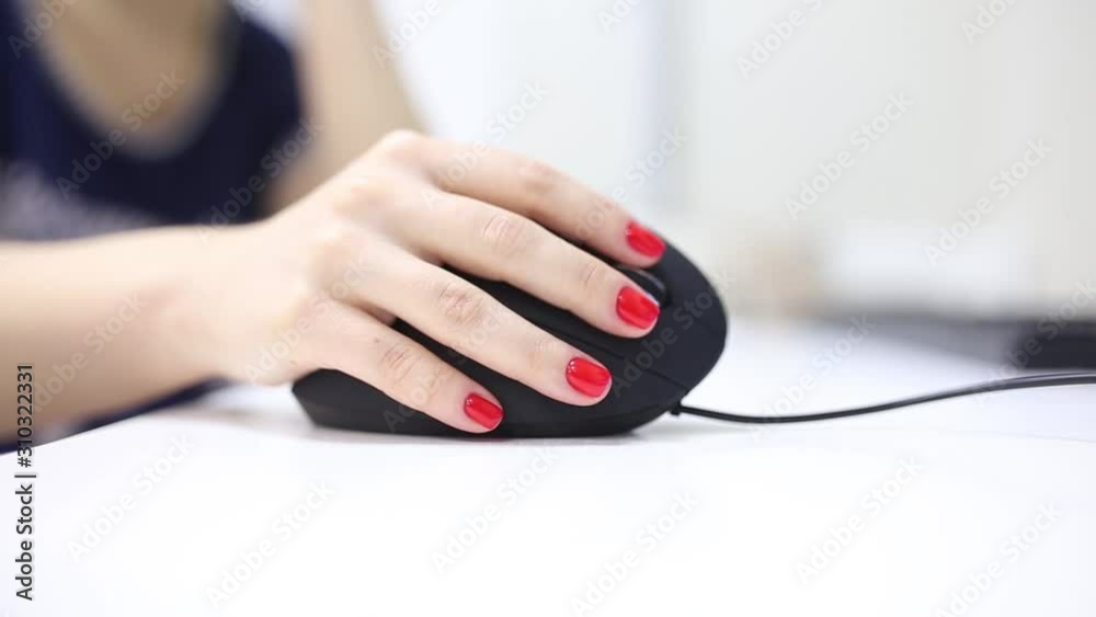 girl's hand uses a vertical ergonomic computer mouse joystick. girl's hand uses a vertical ergonomic computer mouse joystick.