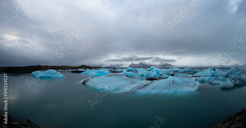 Beautiful blue icebergs float over water at Jokulsarlon glacier lagoon Iceland