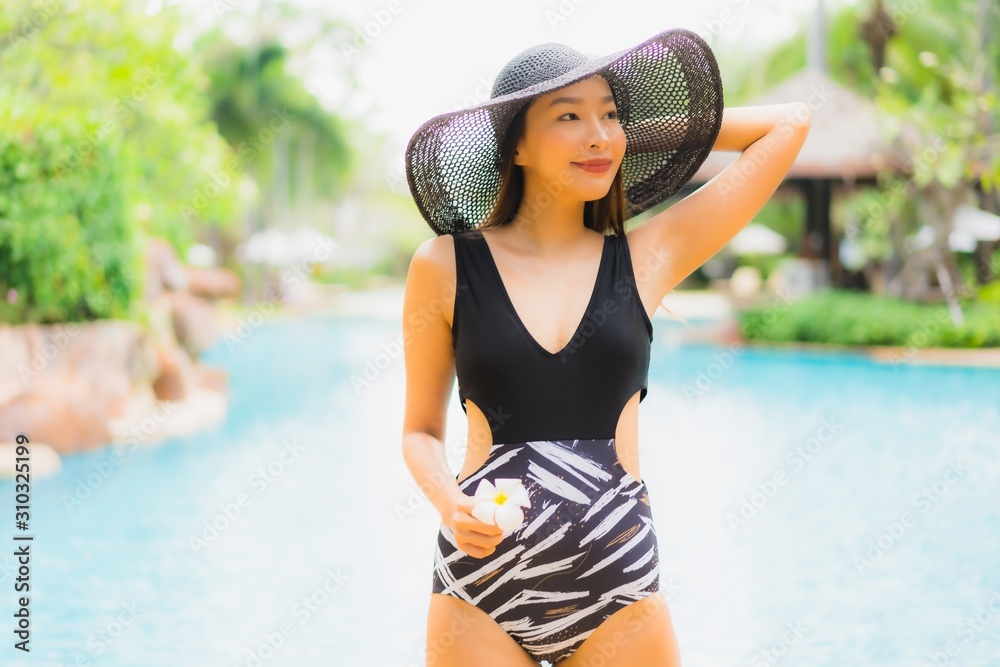 Fototapeta premium Portrait beautiful young asian women happy smile relax around swimming pool