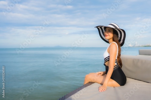 Portrait beautiful young asian women relax smile happy around sea beach ocean
