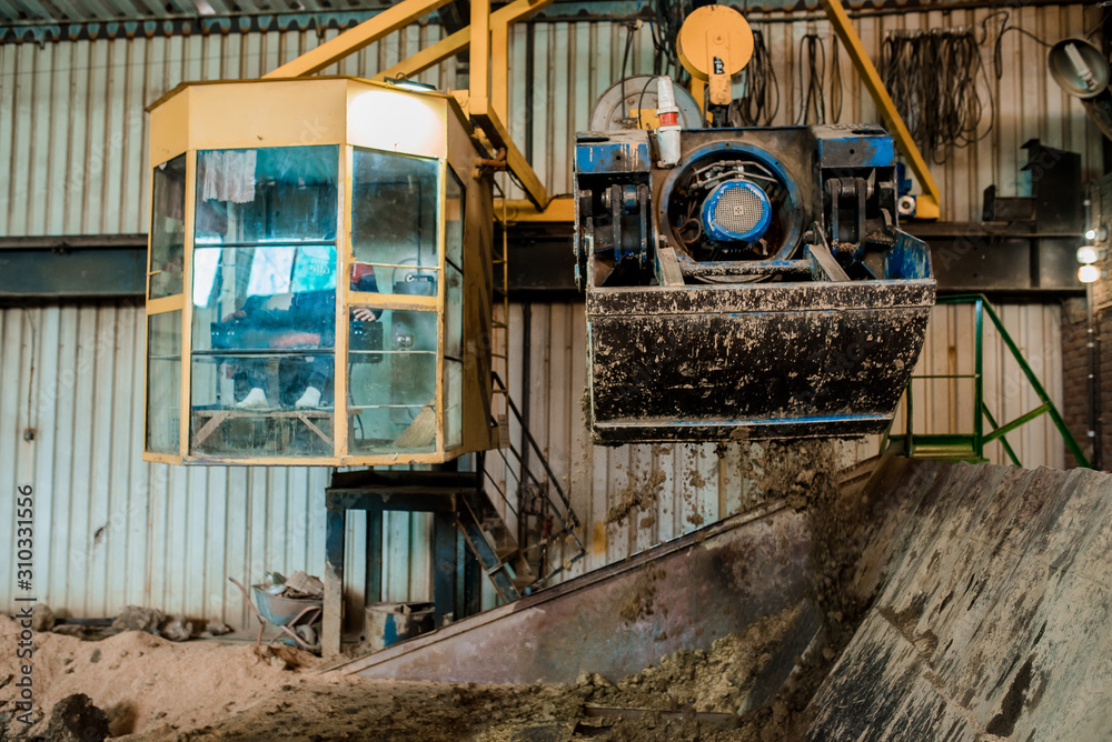 Clay for bricks. Plant for production building material with ready brick, construction industrial. Production of bricks on plant. Workflow, close-up. Clay for bricks. Plant for production building material with ready brick, construction industrial. Production of bricks on plant. Workflow, close-up.