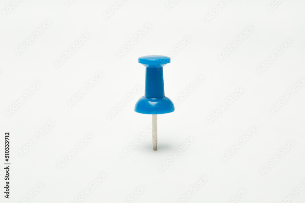 Close up of Blue pin on white background Close up of Blue pin on white background