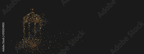 Ramadan background. Design is sand with golden squeak of silhouette of an old lamp. Lantern bright sequins loose gold. Holy feast Ramadan Kareem
