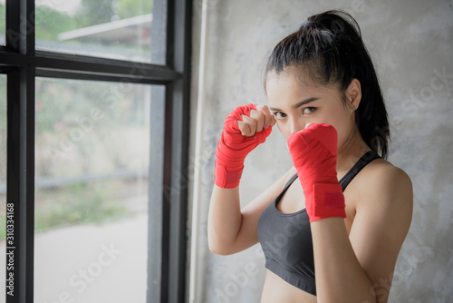 Girl in boxing training in the gym. © Subhakitnibhat