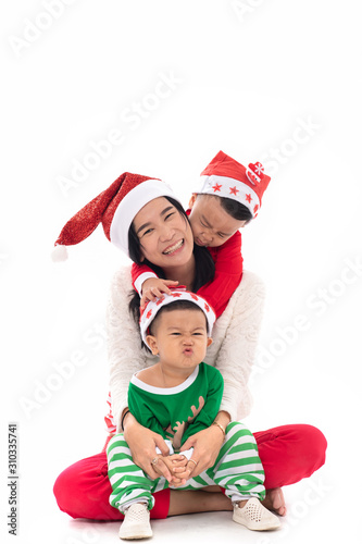 Portrait of beautiful smiling young mother with two sons celebrate on white background. .