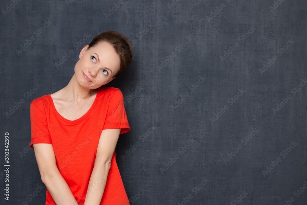 Portrait of cute happy dreamy young woman smiling romantically Portrait of cute happy dreamy young woman smiling romantically