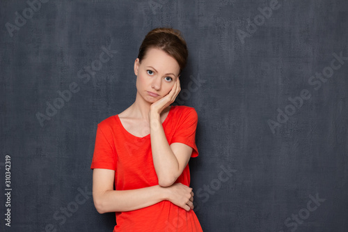 Portrait of bored frustrated young woman sadly waiting for something