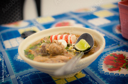 Mee Celup is a traditional dish in Kelantan, Malaysia. Its broth is full of sensational Asian taste. photo