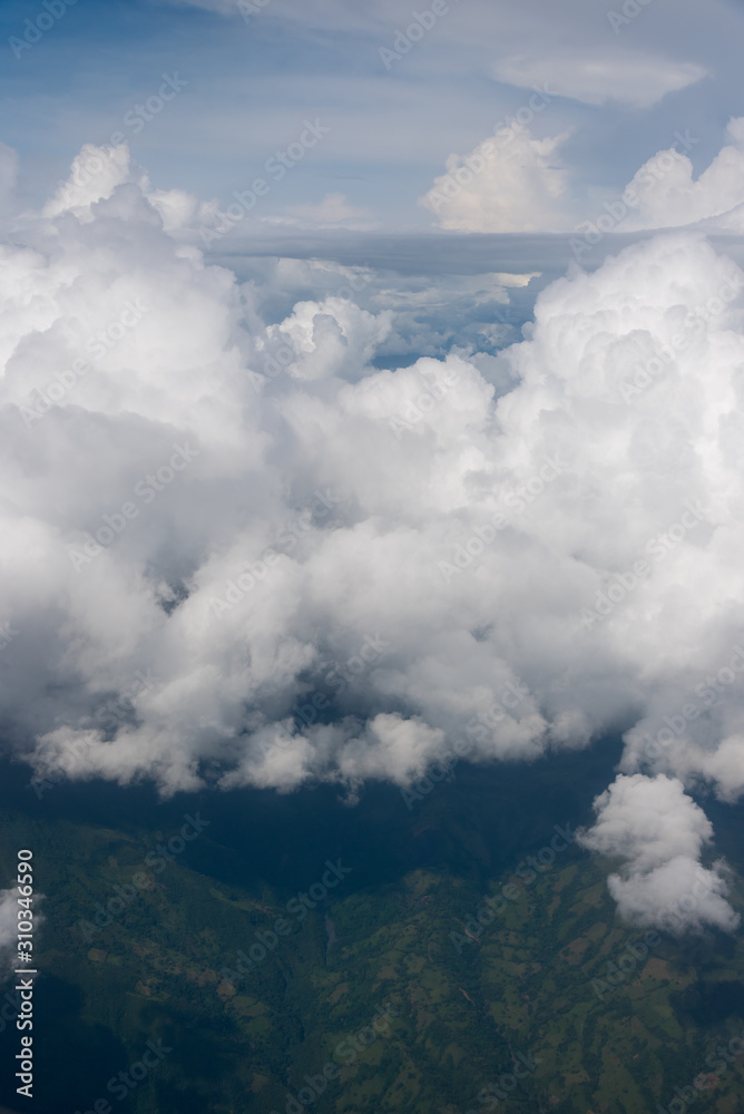 View from a landscape airplane of the Andean mountain ranges between clouds. Colombia View from a landscape airplane of the Andean mountain ranges between clouds. Colombia