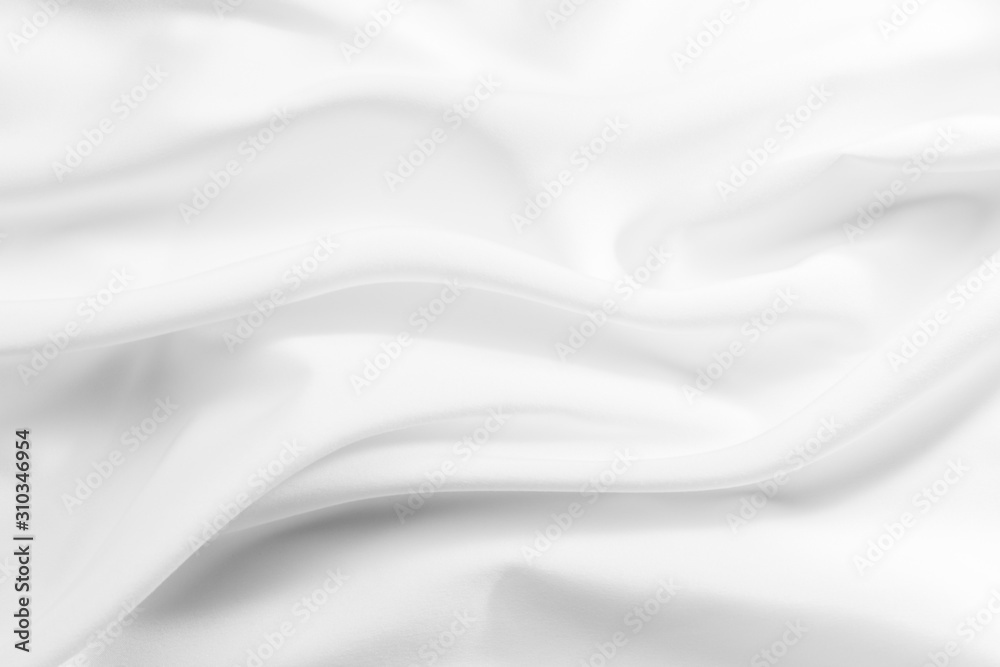 Fototapeta premium Abstract white fabric texture background. Cloth soft wave. Creases of satin, silk, and cotton.