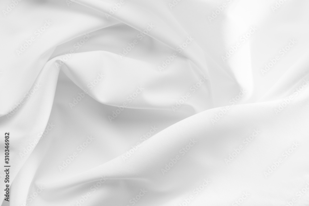 Abstract white fabric texture background. Cloth soft wave. Creases of satin, silk, and cotton.