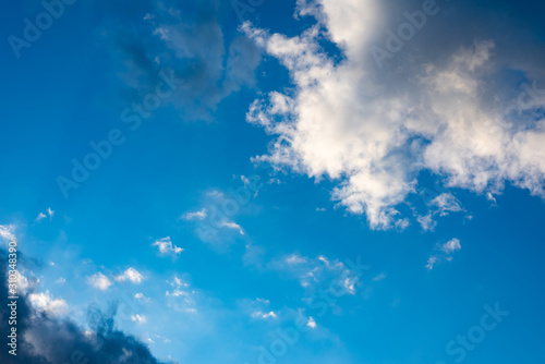 Blue  sky with black clouds. Blue sky with white clouds