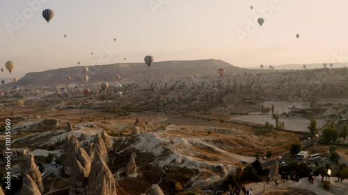 A balloon flies over Cappadocia, shooting from a drone in 4K