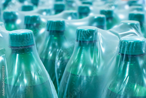 Water in plastic bottles.