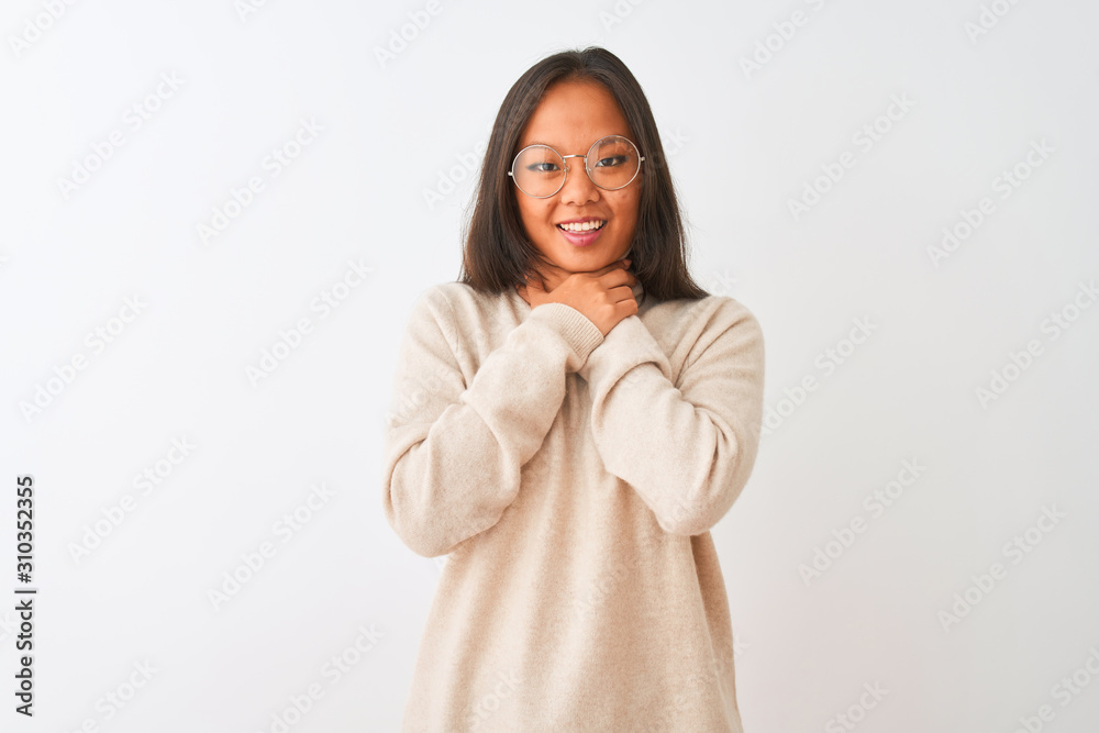 Young chinese woman wearing turtleneck sweater and glasses over isolated white background shouting and suffocate because painful strangle. Health problem. Asphyxiate and suicide concept. Young chinese woman wearing turtleneck sweater and glasses over isolated white background shouting and suffocate because painful strangle. Health problem. Asphyxiate and suicide concept.