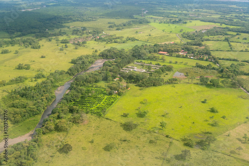 Farm with crops on the banks of a river. Department of Córdoba Colombia