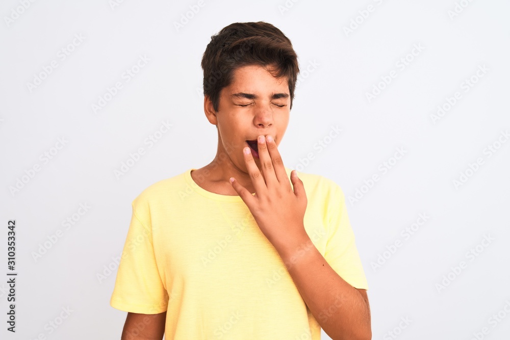 Handsome teenager boy standing over white isolated background bored yawning tired covering mouth with hand. Restless and sleepiness. Handsome teenager boy standing over white isolated background bored yawning tired covering mouth with hand. Restless and sleepiness.