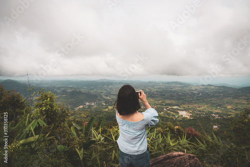 Fotografia, Obraz young cute Japanese Asian hipster girl travelling at beautiful sky  mountains sc